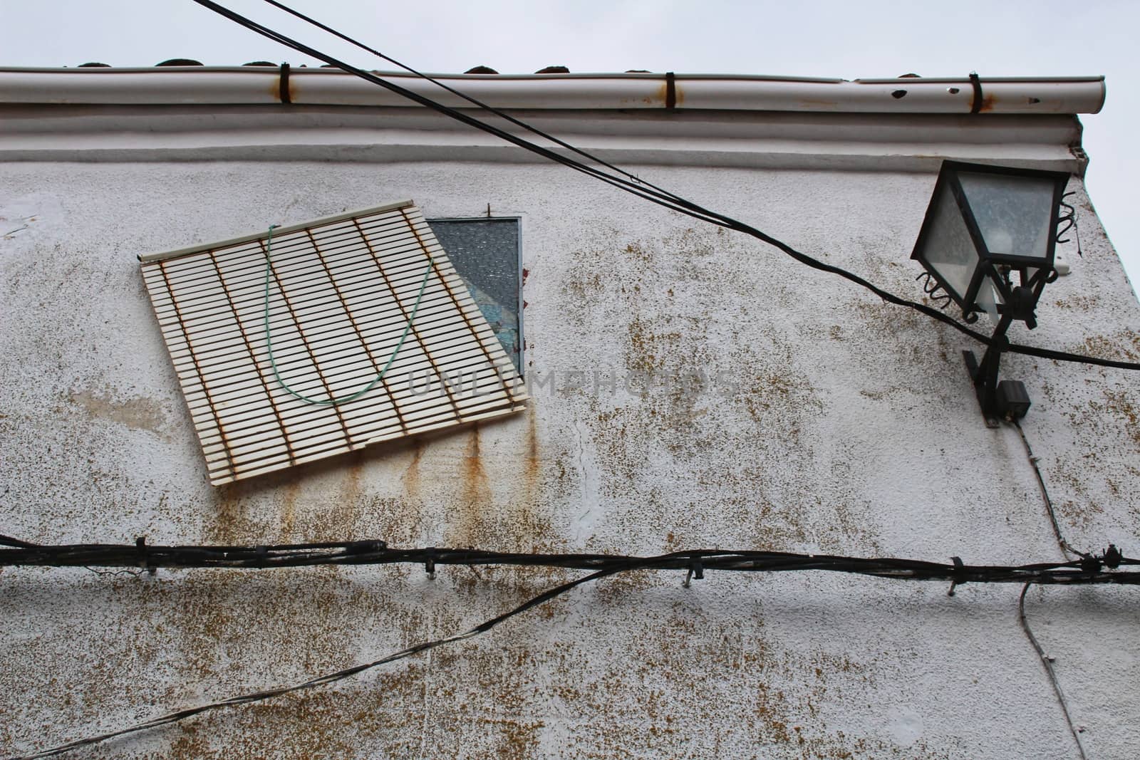 Old facade and streetlight in a small village of Castilla La Mancha community, Spain