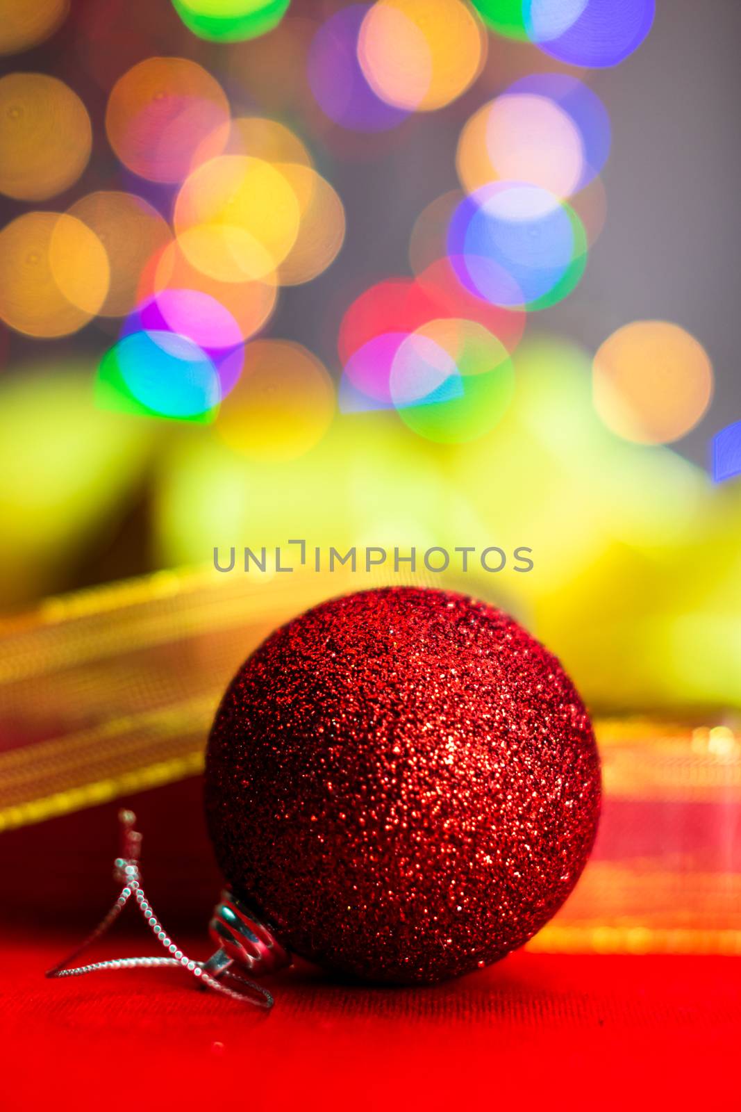 Red glittery decoration in a colorful Christmas composition isol by vladispas