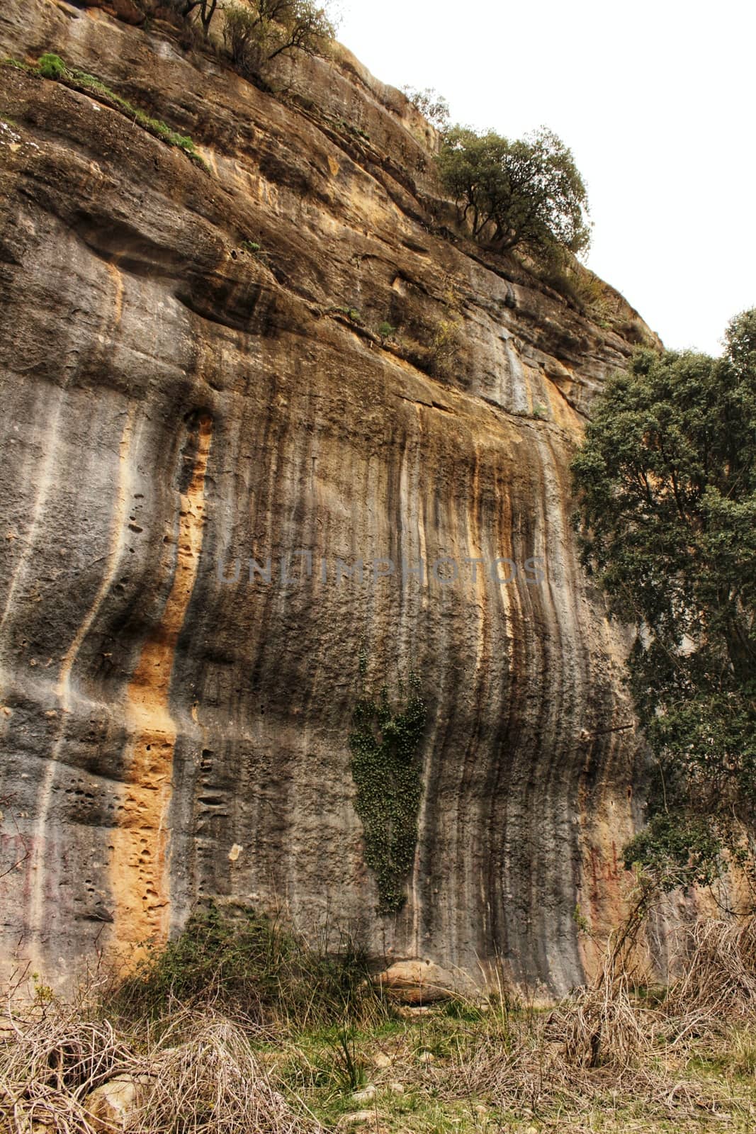 Mountain wall with colorful streaks in the Sierra of Alcaraz, Castile-la Mancha community, Spain