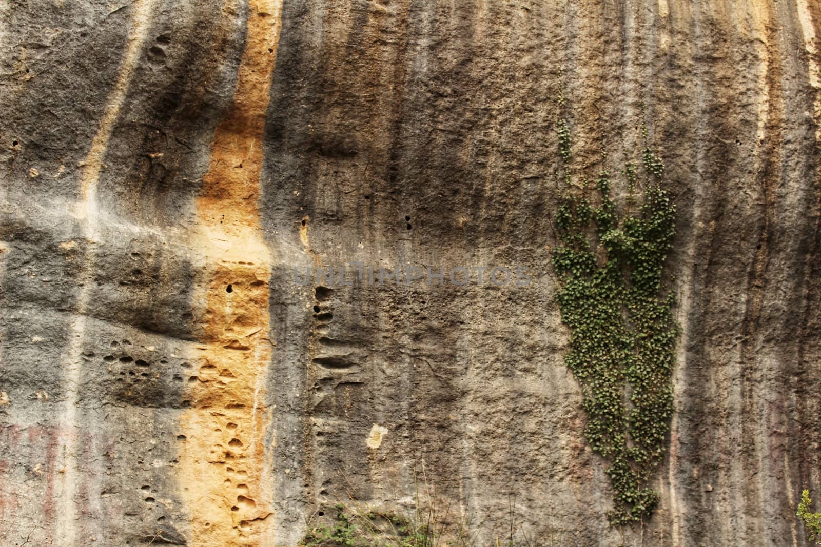 Mountain wall with colorful streaks in the Sierra of Alcaraz, Castile-la Mancha community, Spain