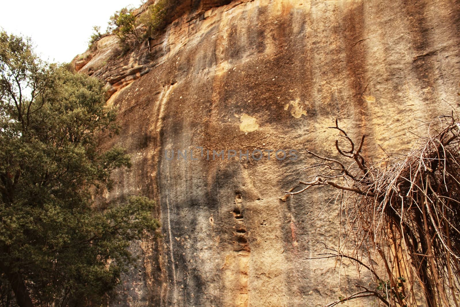 Mountain wall with colorful streaks in the Sierra of Alcaraz, Castile-la Mancha community, Spain