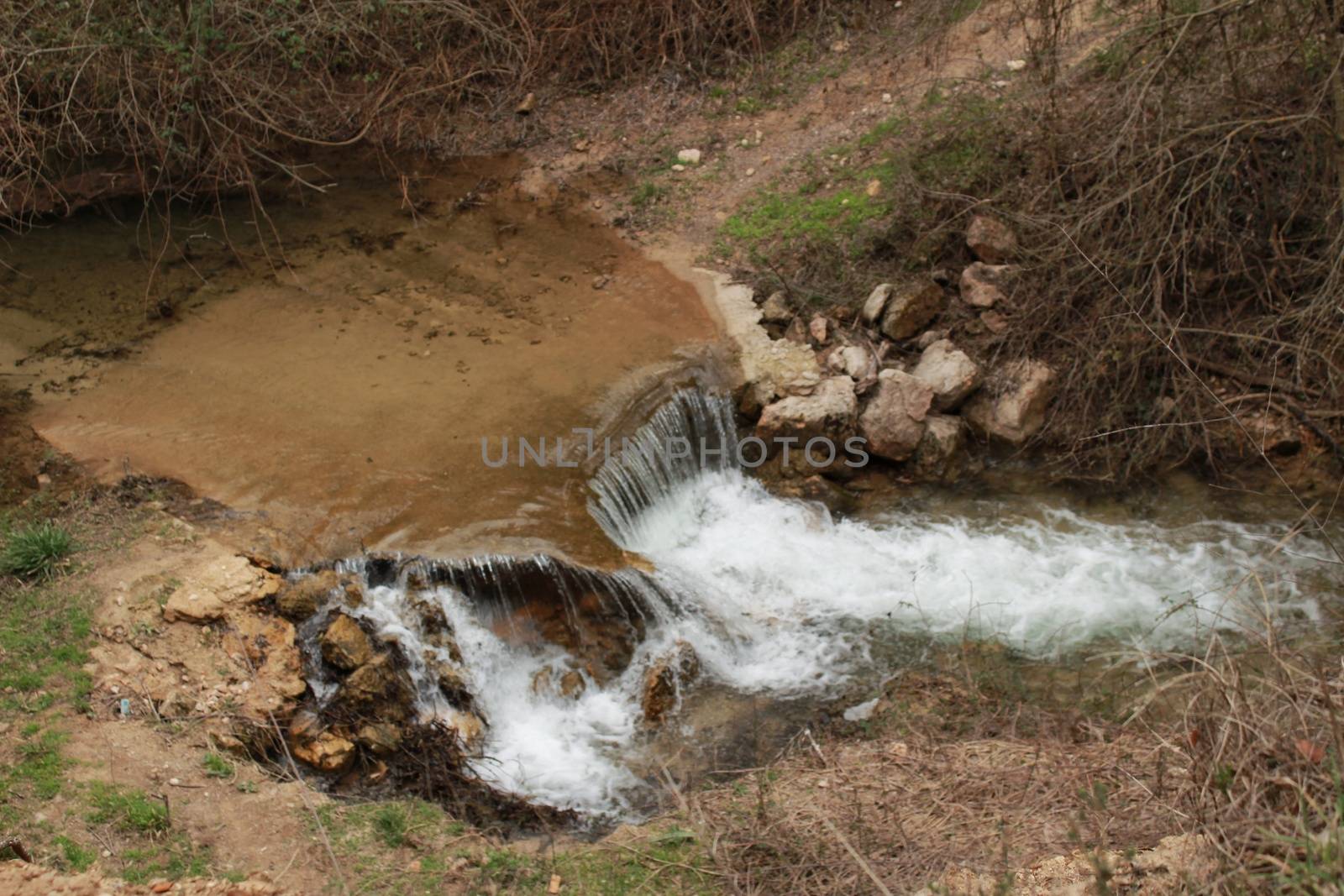 Waterfall called El Salto del Caballo and Alcaraz river crossing the natural site of Los Batanes, Alcaraz, Albacete, Spain