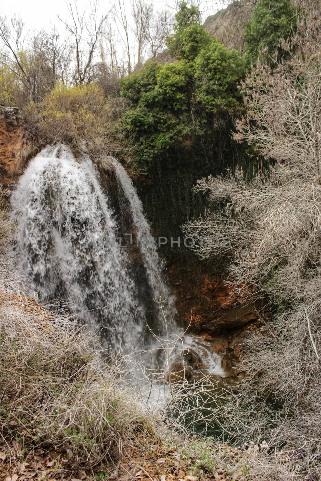 Waterfall and Alcaraz river crossing natural site of Los Batanes in spring by soniabonet