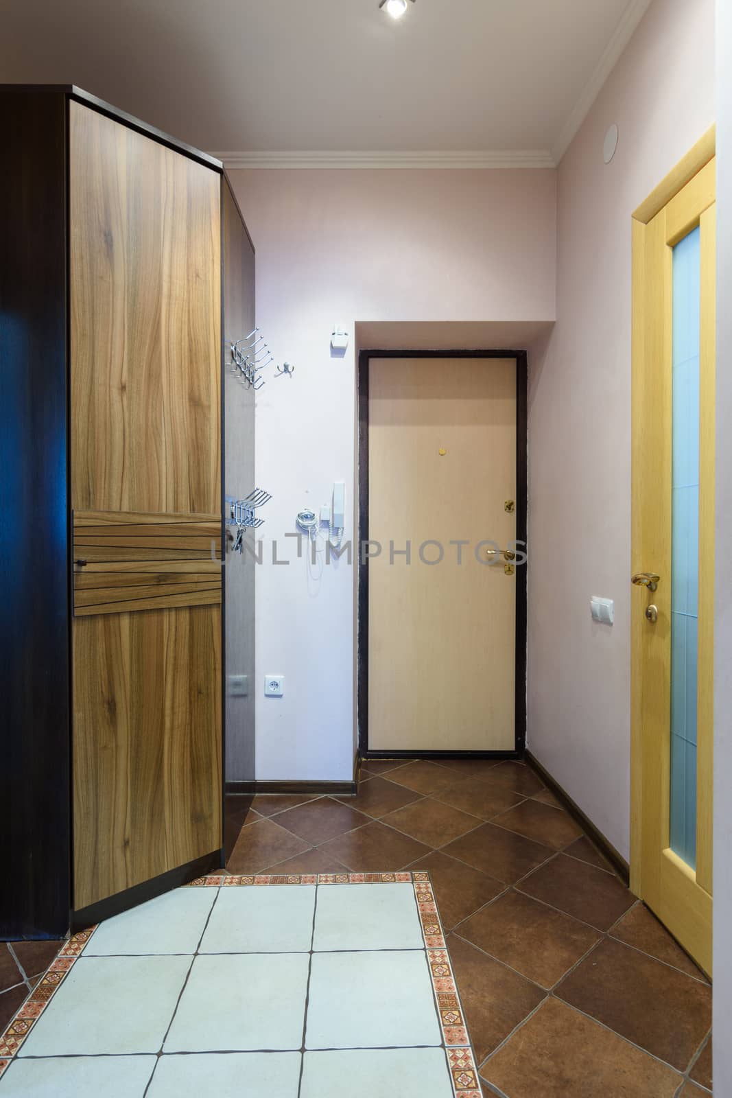 The interior of the corridor in the apartment, view of the front door