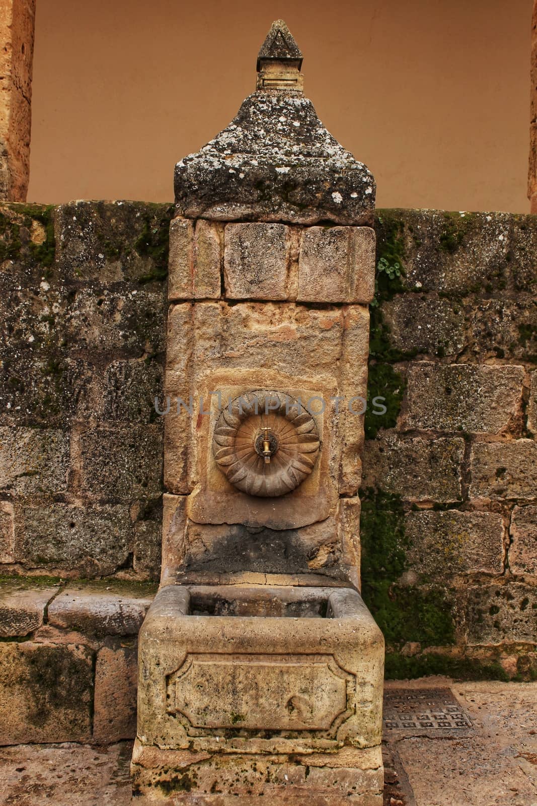 Old stone fountain in la Plaza Mayor in Alcaraz, Castile-La Mancha, Spain