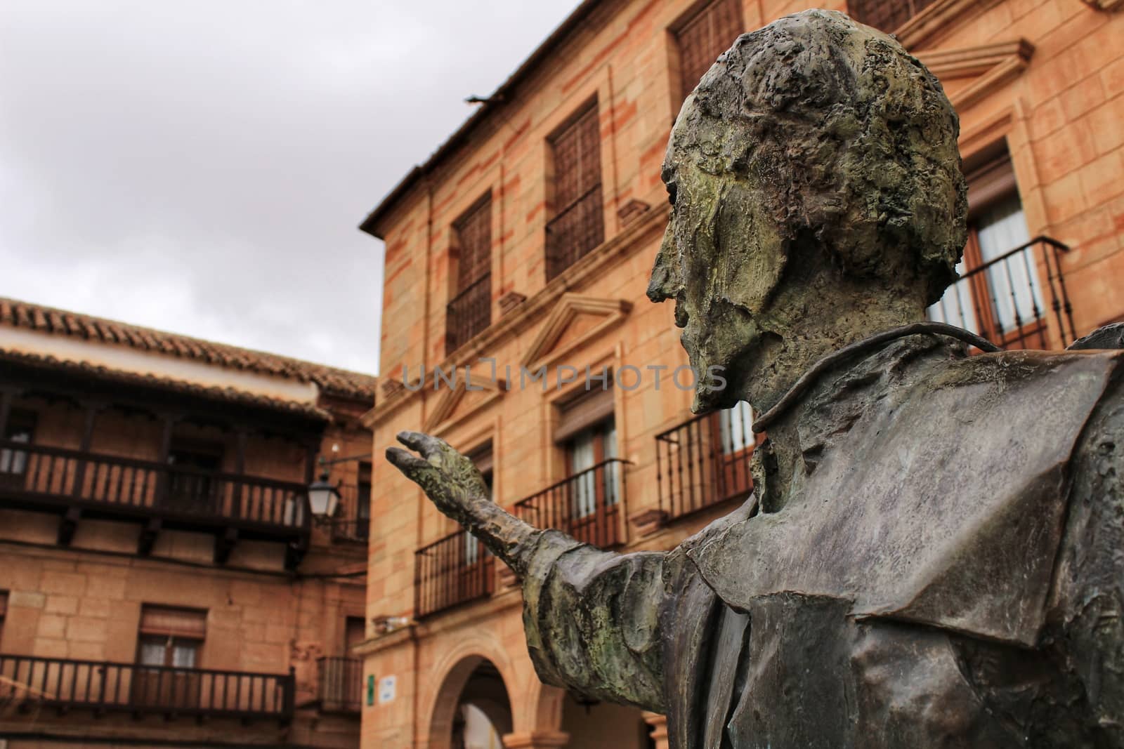 Villanueva de los Infantes square and Don Quixote statue in the foreground by soniabonet