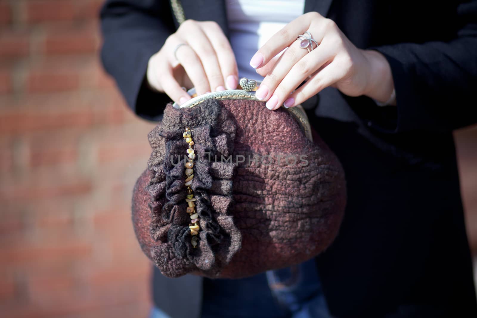 brown Elegant Felting wool fashion handmade handbag in hand. street fashion look