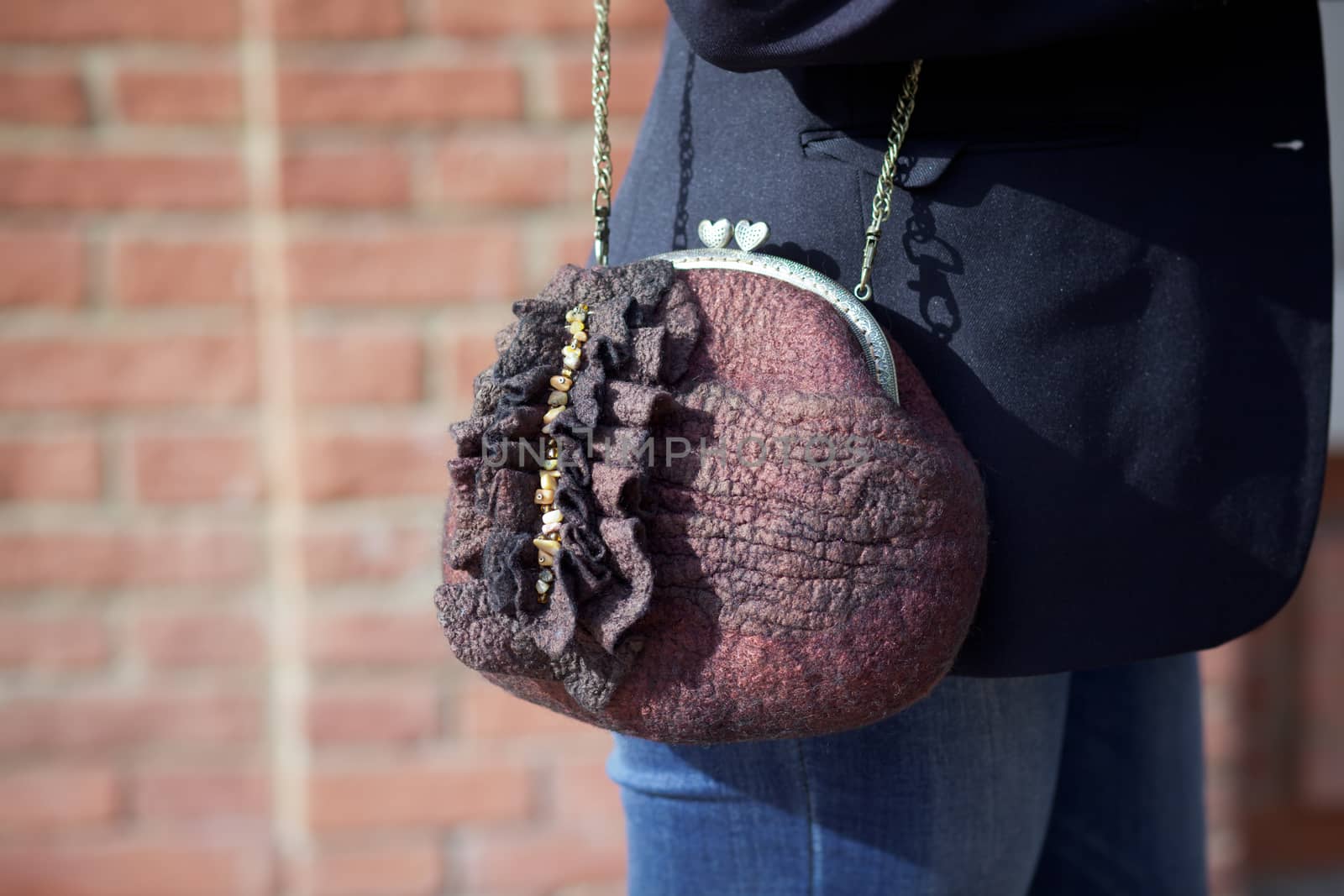 brown Elegant Felting wool fashion handmade handbag in hand. street fashion look