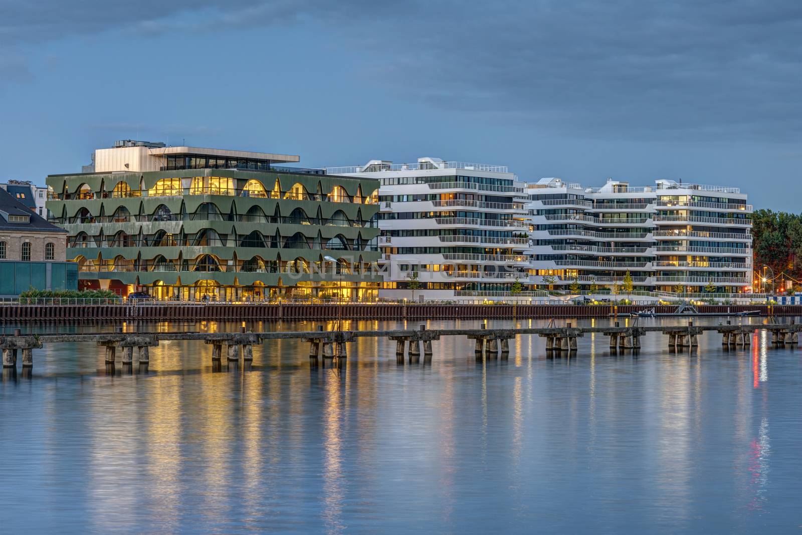 New apartment buildings at the river Spree in Berlin at dusk
