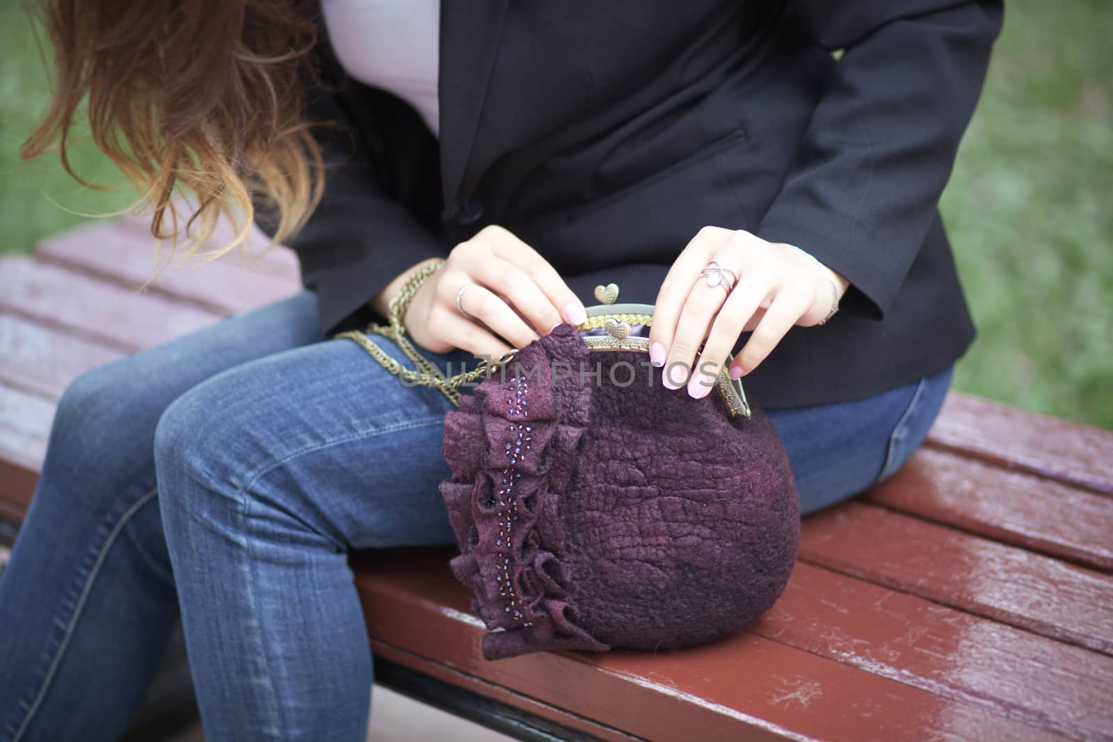 purple Elegant Felting wool fashion handmade handbag in hand. street fashion look