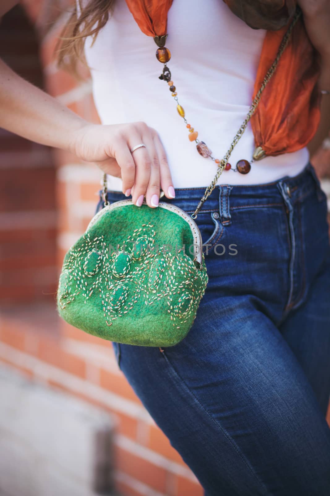 green Elegant Felting wool fashion handmade handbag in hand. street fashion look