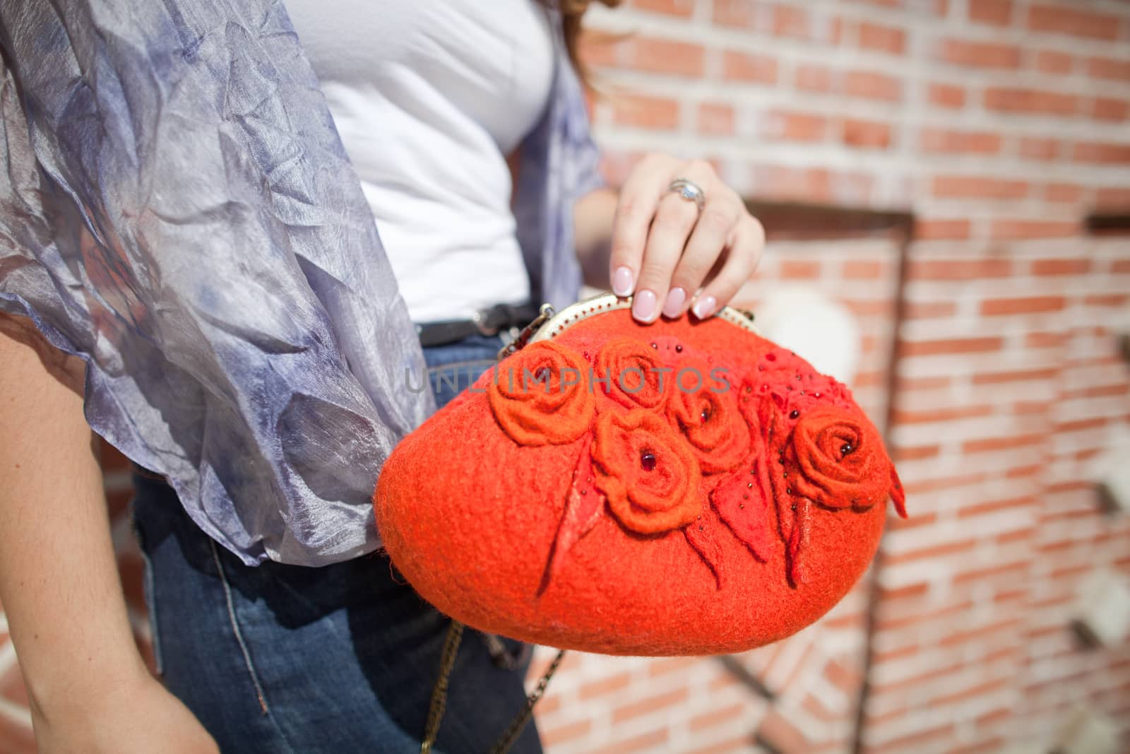 red Elegant Felting wool fashion handmade handbag in hand. street fashion look