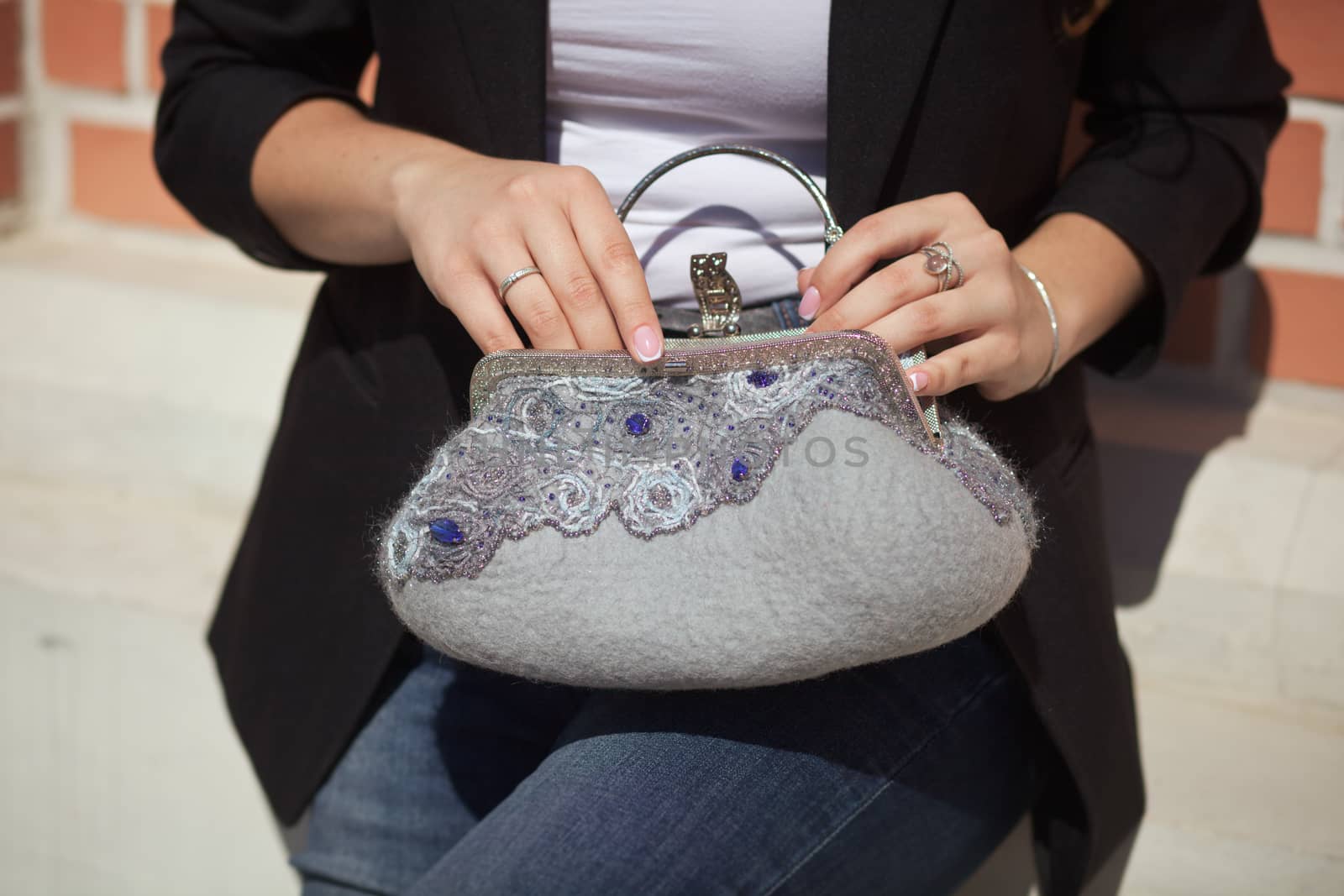 gray Elegant Felting wool fashion handmade handbag in hand. street fashion look