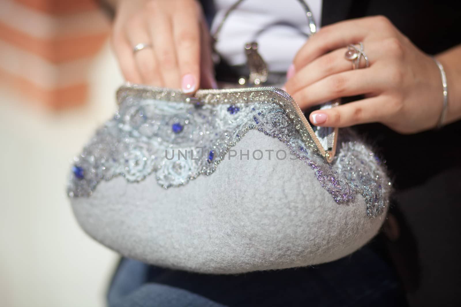 gray Elegant Felting wool fashion handmade handbag in hand. street fashion look