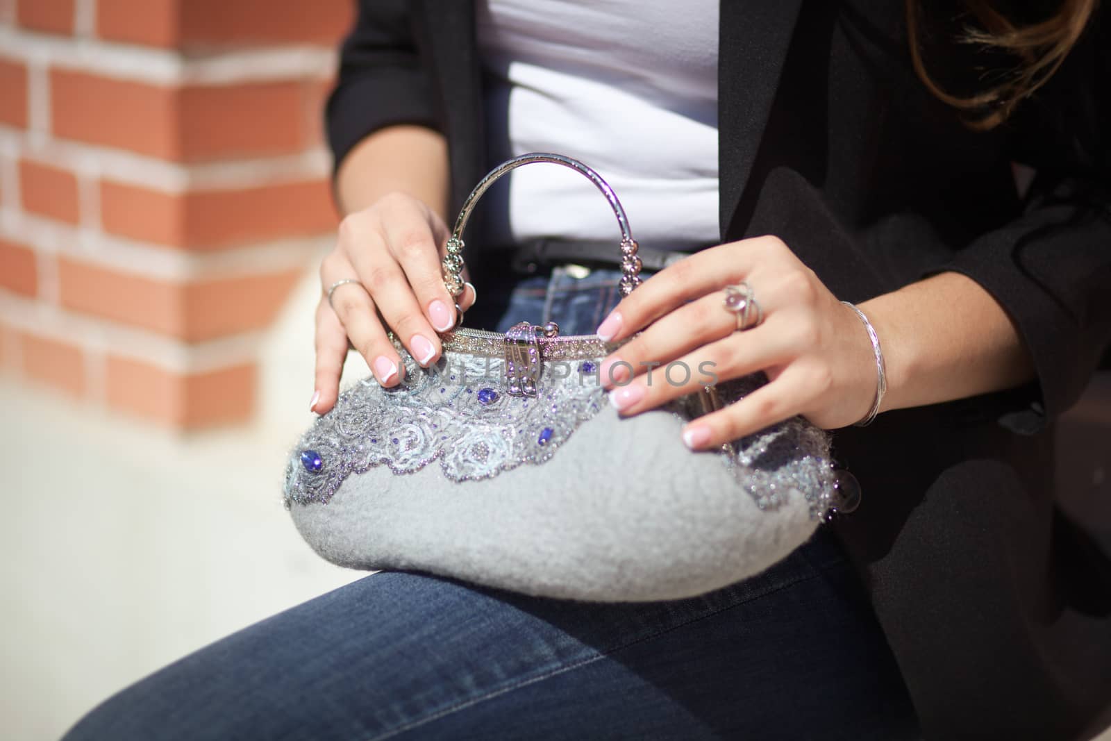 gray Elegant Felting wool fashion handmade handbag in hand. street fashion look
