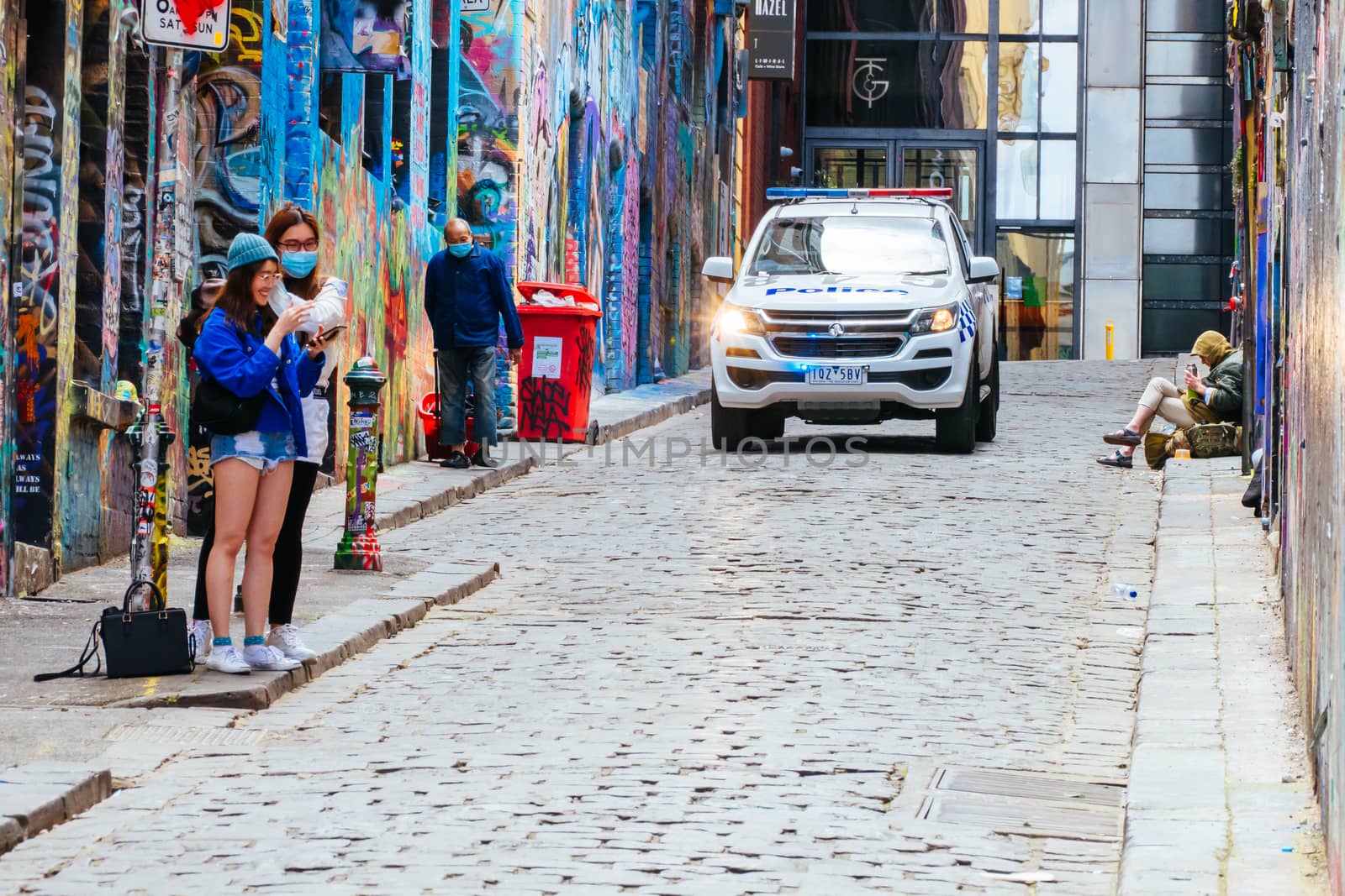 Melbourne, Australia - October 10th 2020: Police do routine checks against pandemic rules in Hosier Lane during the Coronavirus pandemic and associated lockdown.