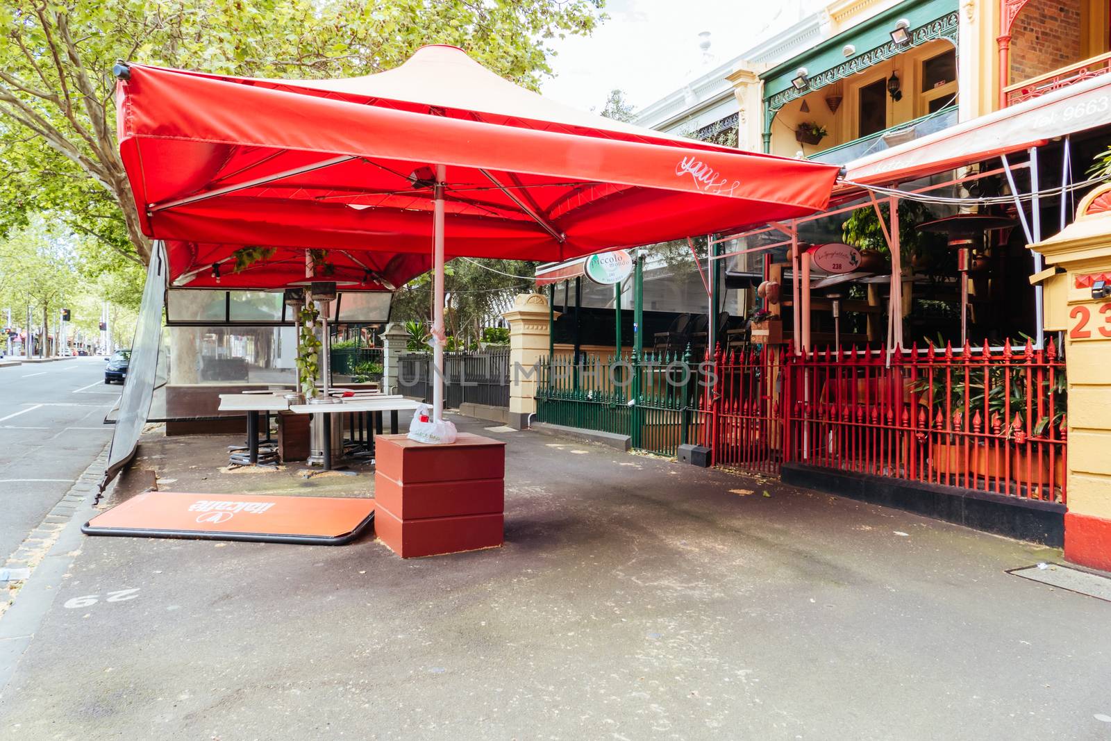 Melbourne, Australia - October 10th 2020: Lygon St restaurants are closed and packed up empty during the Coronavirus pandemic and associated lockdown.