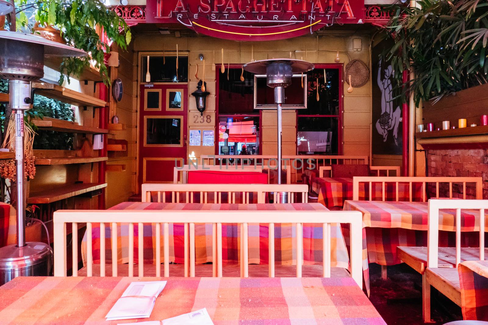 Melbourne, Australia - October 10th 2020: Lygon St restaurants are closed and packed up empty during the Coronavirus pandemic and associated lockdown.
