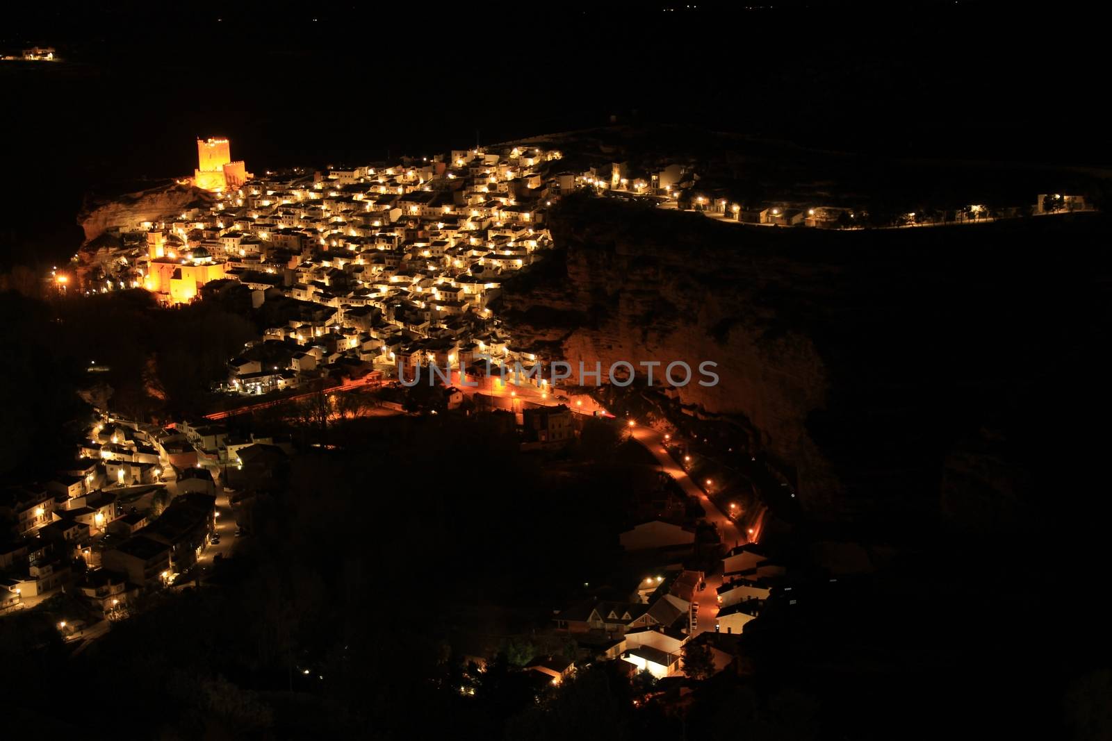 Views of the illuminated village of Alcala del Jucar at night from the viewpoint in Spring