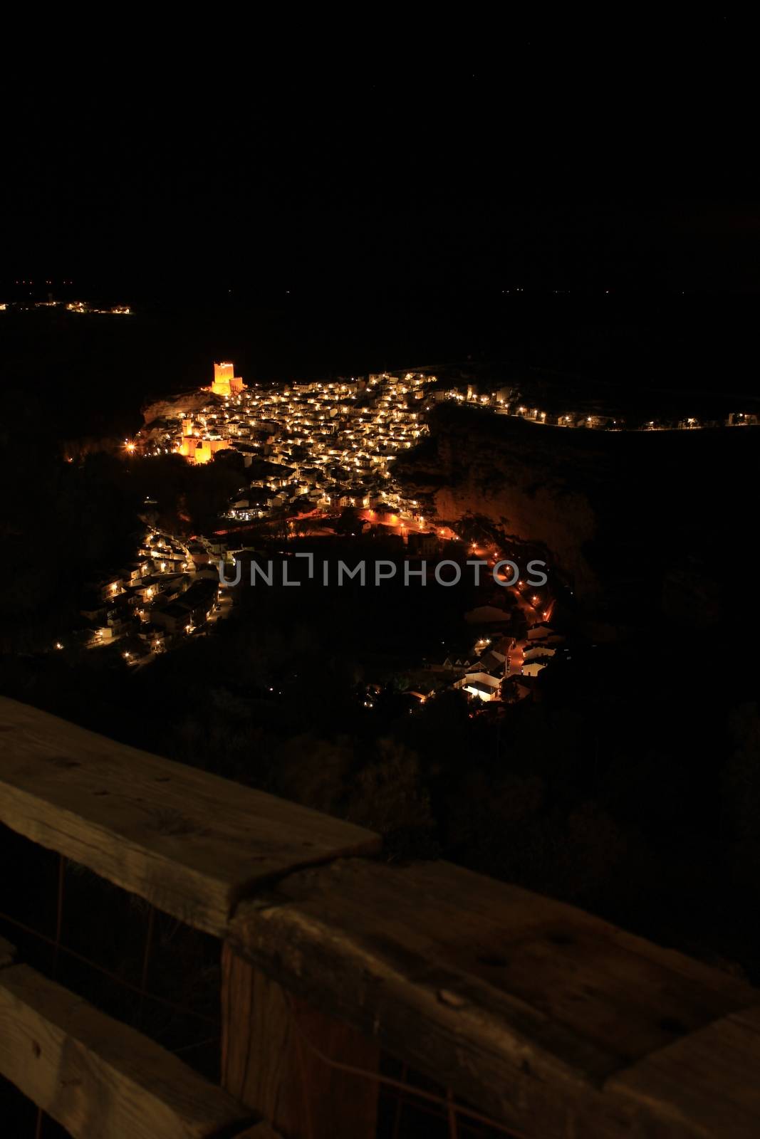 Views of the illuminated village of Alcala del Jucar at night from the viewpoint in Spring