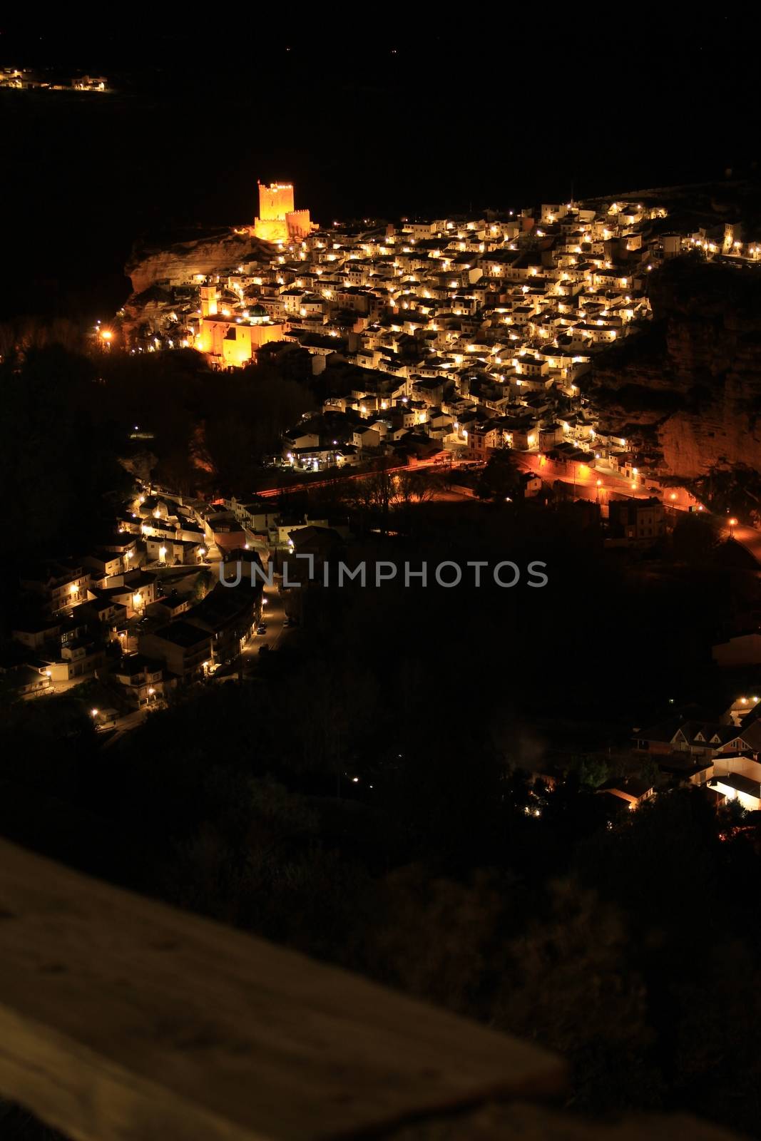 Views of the illuminated village of Alcala del Jucar at night from the viewpoint by soniabonet