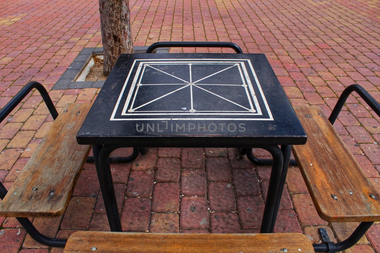 Board games on the street on wooden table and chairs