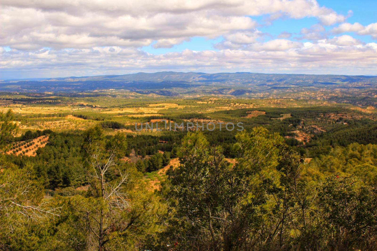 Landscape of the sierra of Utiel Requena in Valencia, Spain under cloudy sky in spring