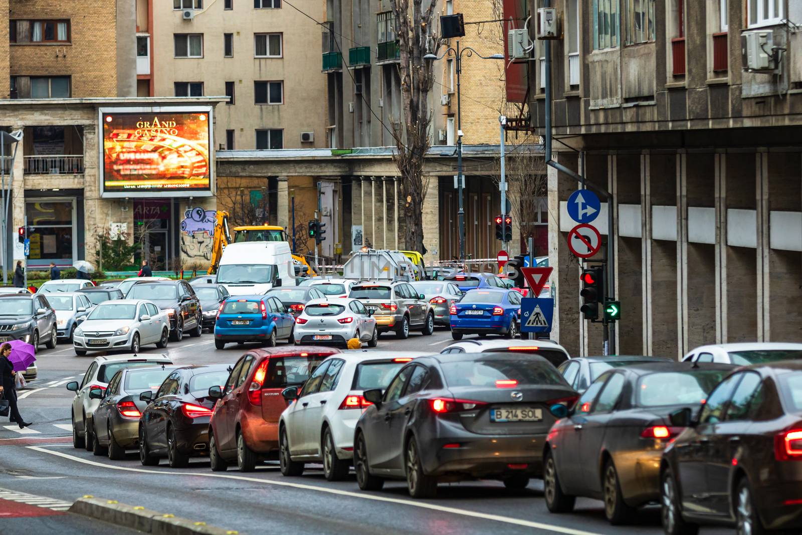 Car traffic at rush hour in downtown area of the city. Car pollution, traffic jam in the morning and evening in the capital city of Bucharest, Romania, 2020