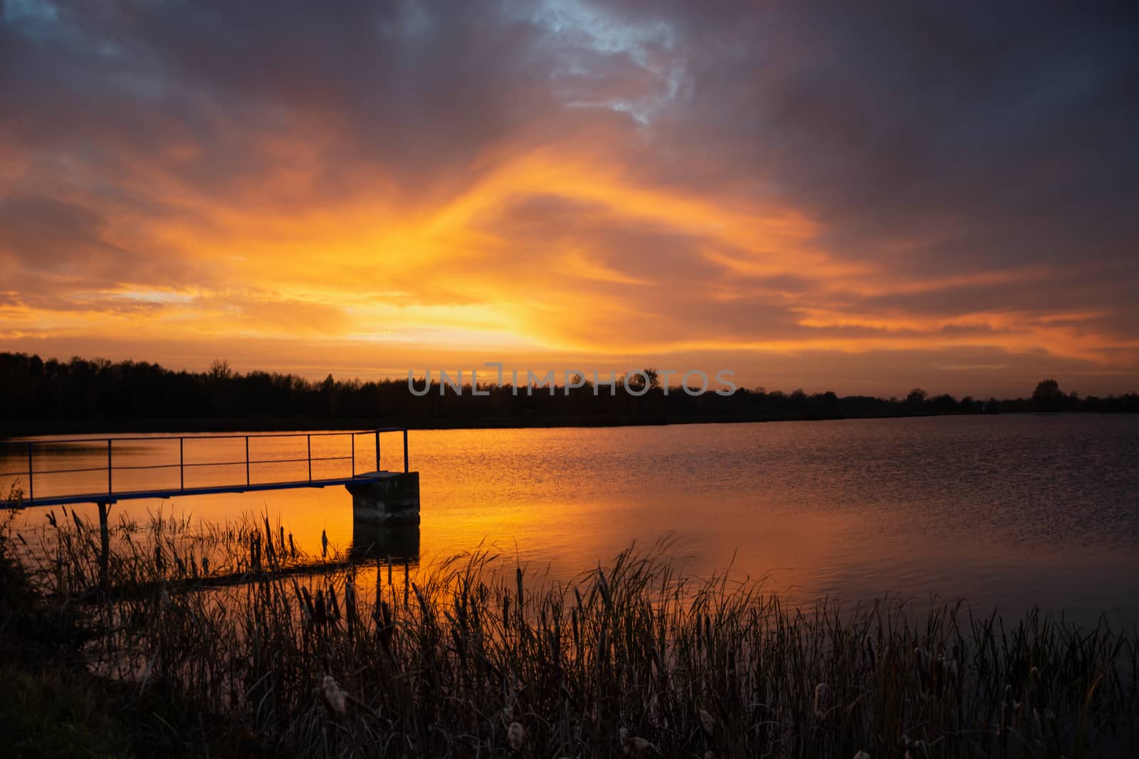Colorful evening clouds during sunset over the lake, Staw, Poland