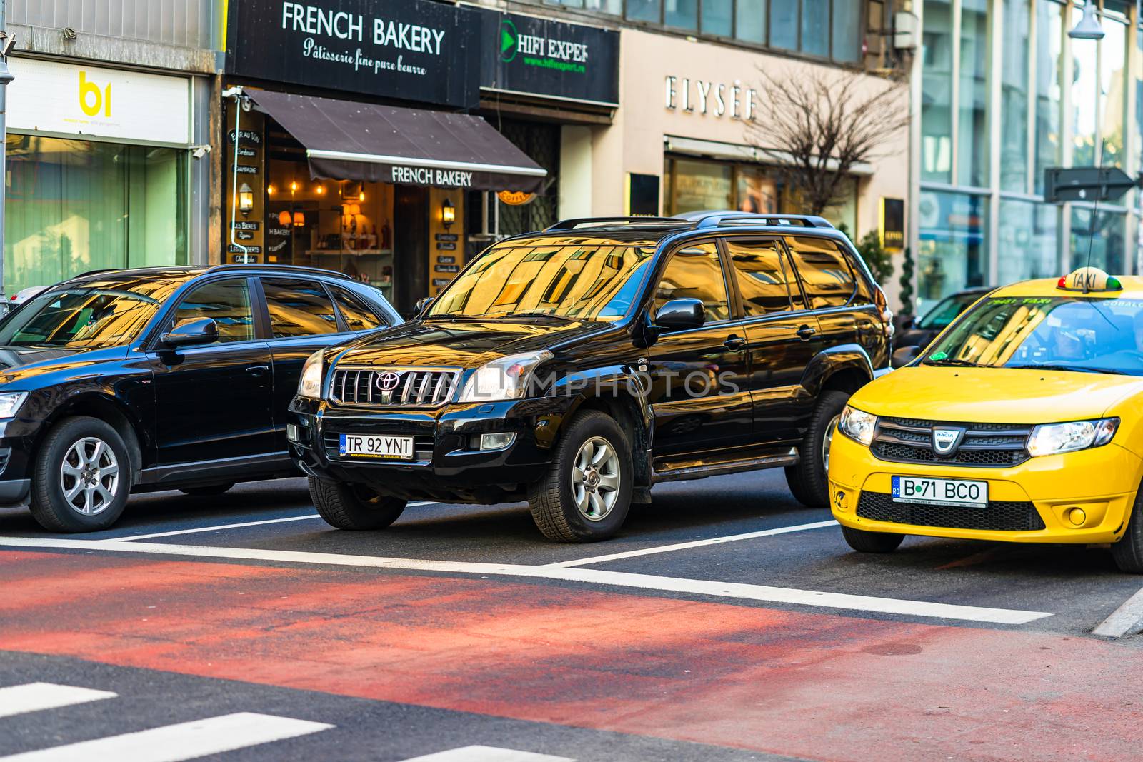 Car traffic at rush hour in downtown area of the city. Car pollution, traffic jam in the morning and evening in the capital city of Bucharest, Romania, 2020