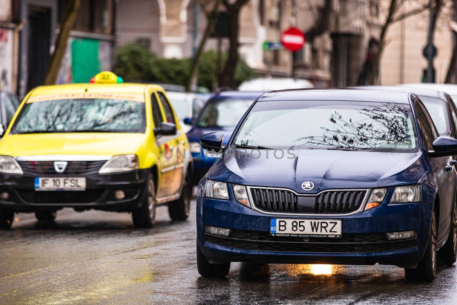 Car traffic at rush hour in downtown area of the city. Car pollu by vladispas