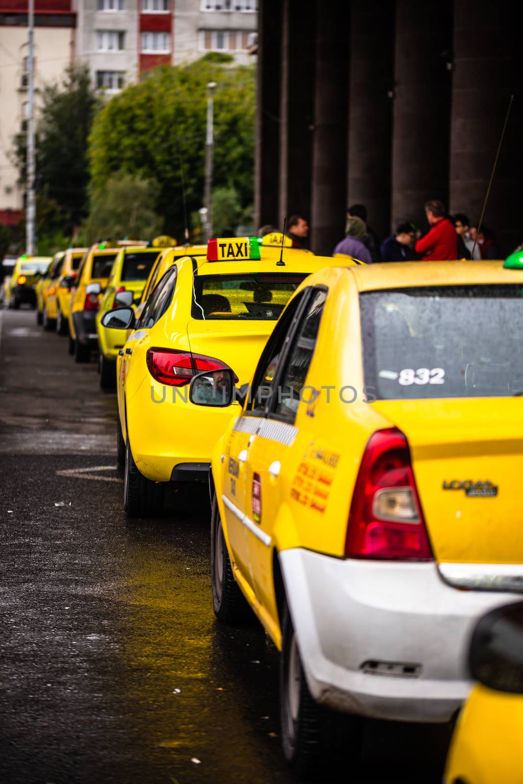 Car in traffic, modern city taxi service. Taxi cars parked at th by vladispas