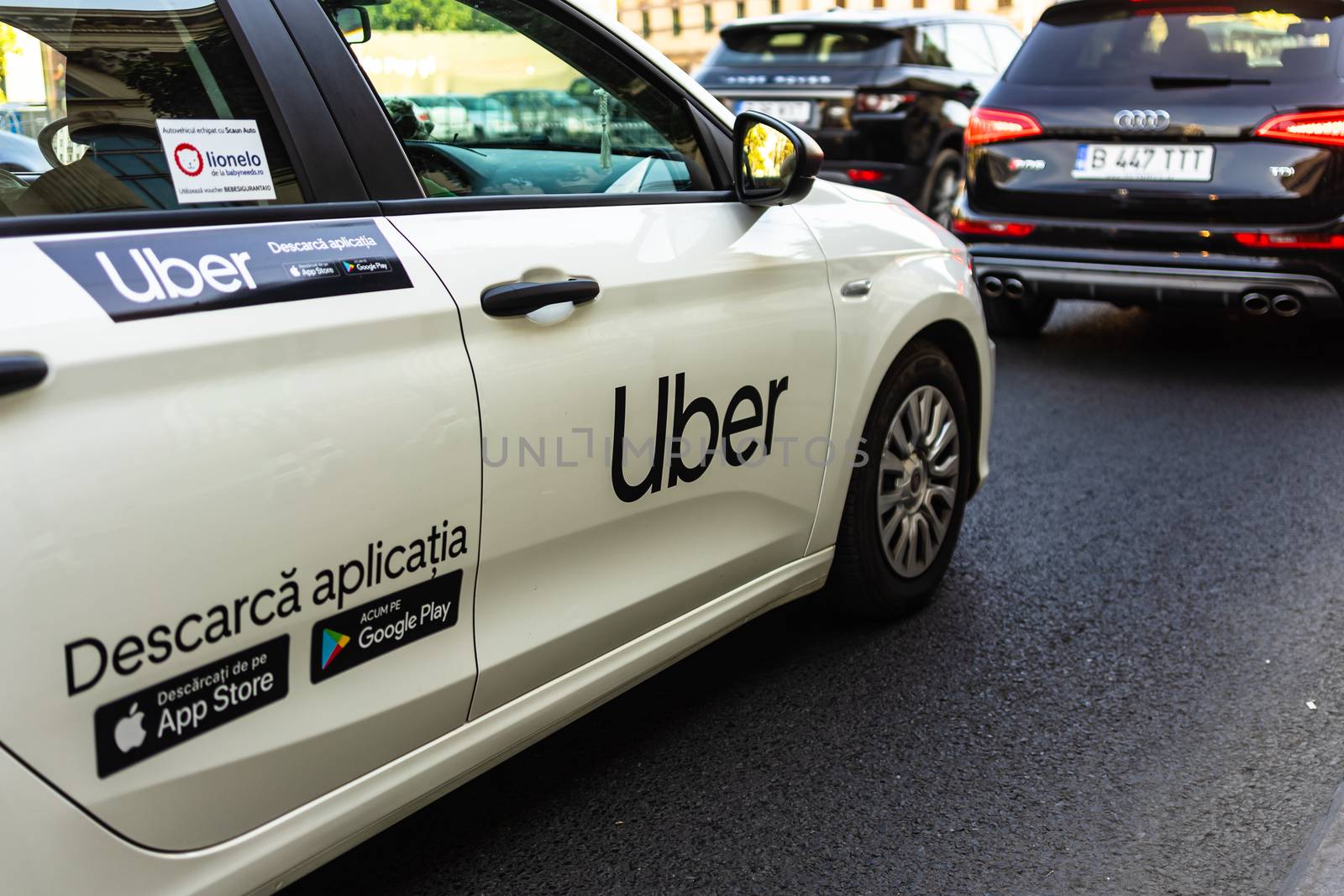 Uber car in traffic, modern city taxi service. Car pollution, tr by vladispas