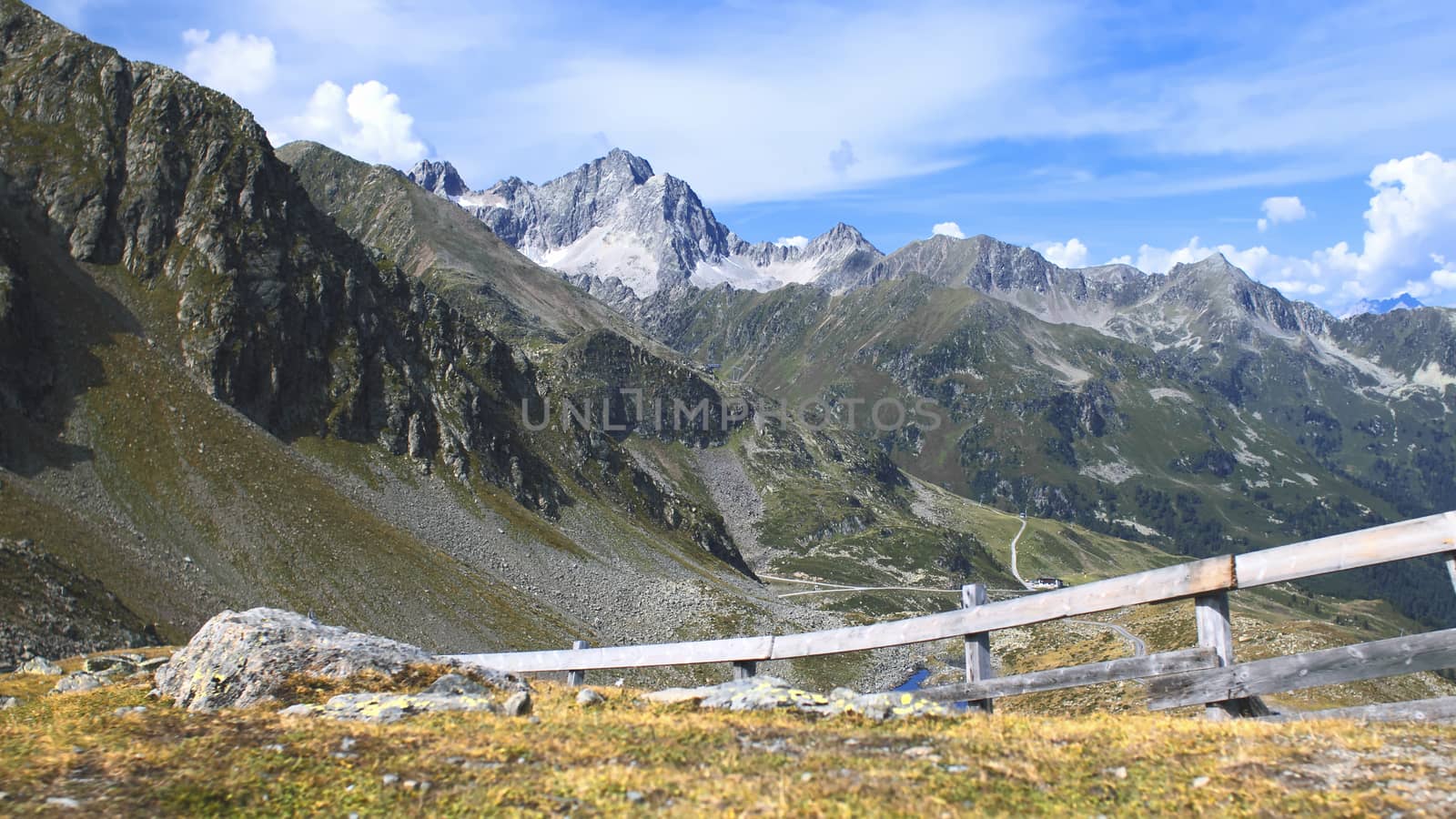 The high mountains of the Austrian Alps in Kuhtai during summer season. The sunshine illuminates the beautiful landscape.