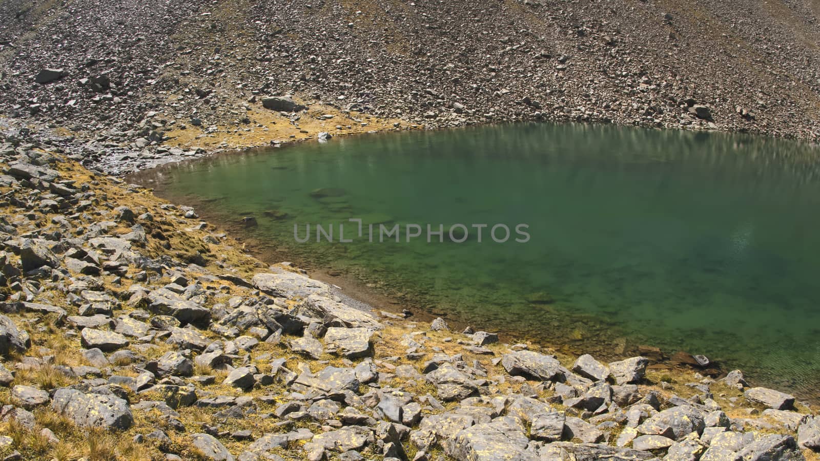 The high mountains of the Austrian Alps in Kuhtai during summer season. The sunshine illuminates the beautiful landscape.