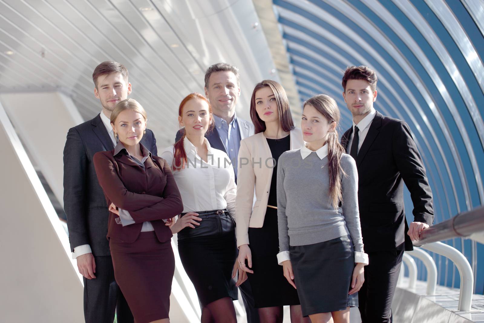 Portrait of business team of men and women in modern building