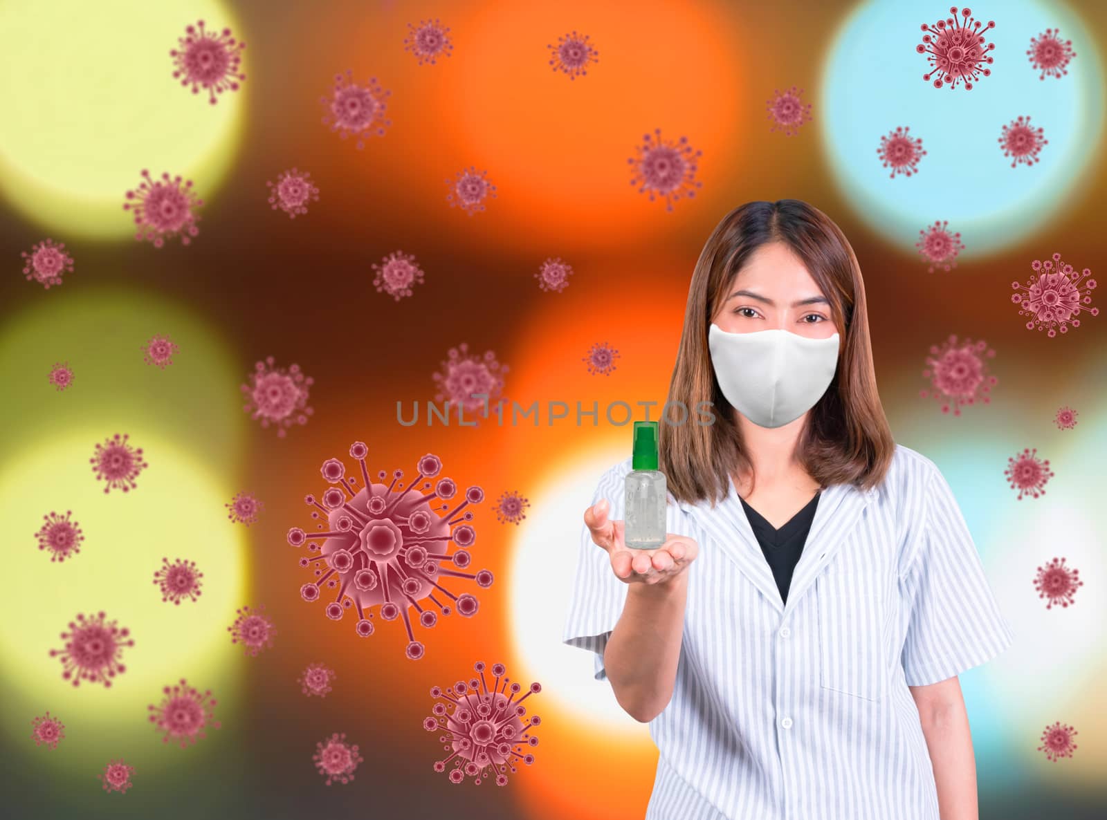 woman wear mask white fabric prophylaxis virus and holding bottle gel alcohol on and virus bokeh background. coronavirus or (Covid-2019) concept