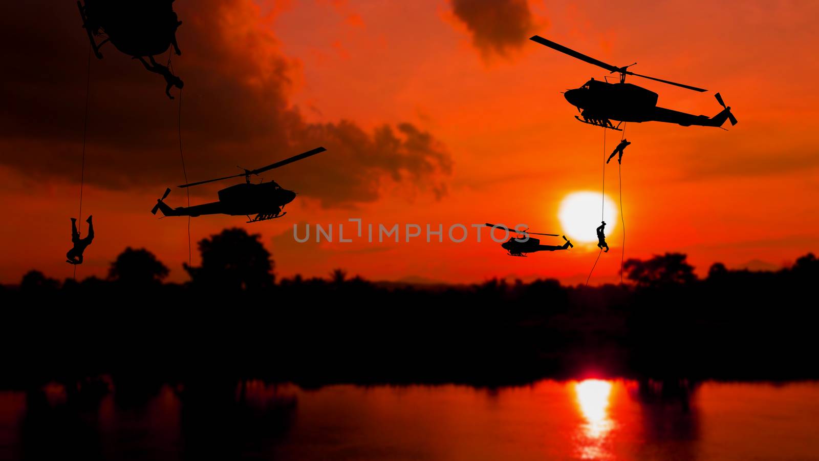soldier silhouette climb down from helicopter on sunset Concept  by pramot