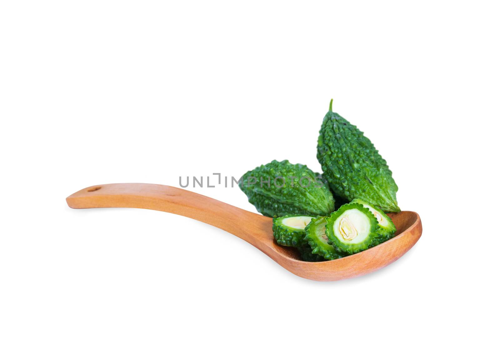 Bitter gourd pile with piece in Wooden spoon on white background by pramot