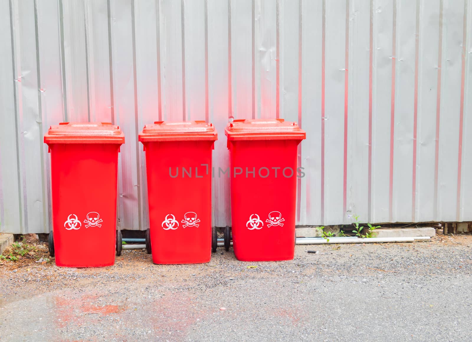 red bins three with symbol infectious in the outdoors keep clean from germs virus. concept prevent garbage infection coronavirus (covid-19)