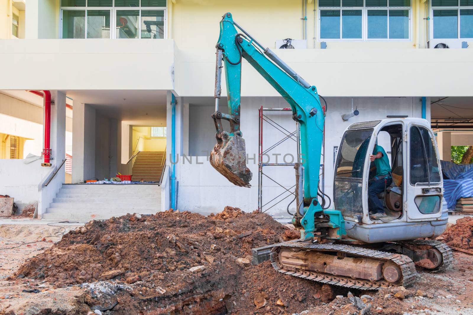 small excavator working excavation site construction