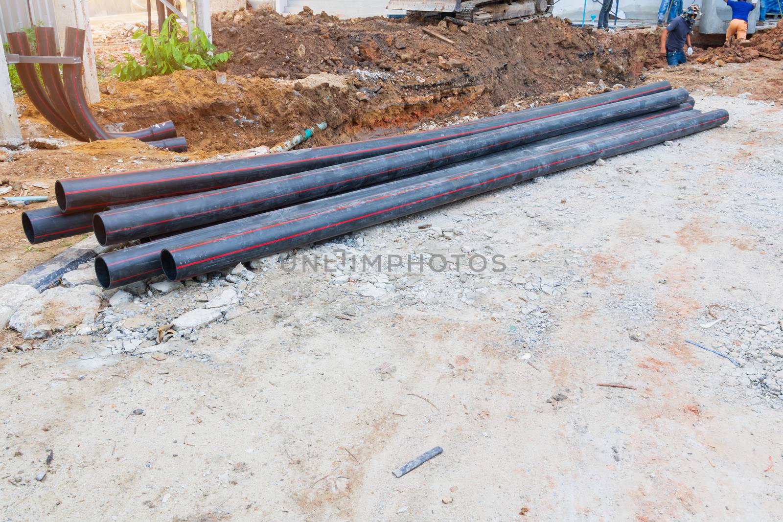 pile pipes black repair water On the ground by pramot