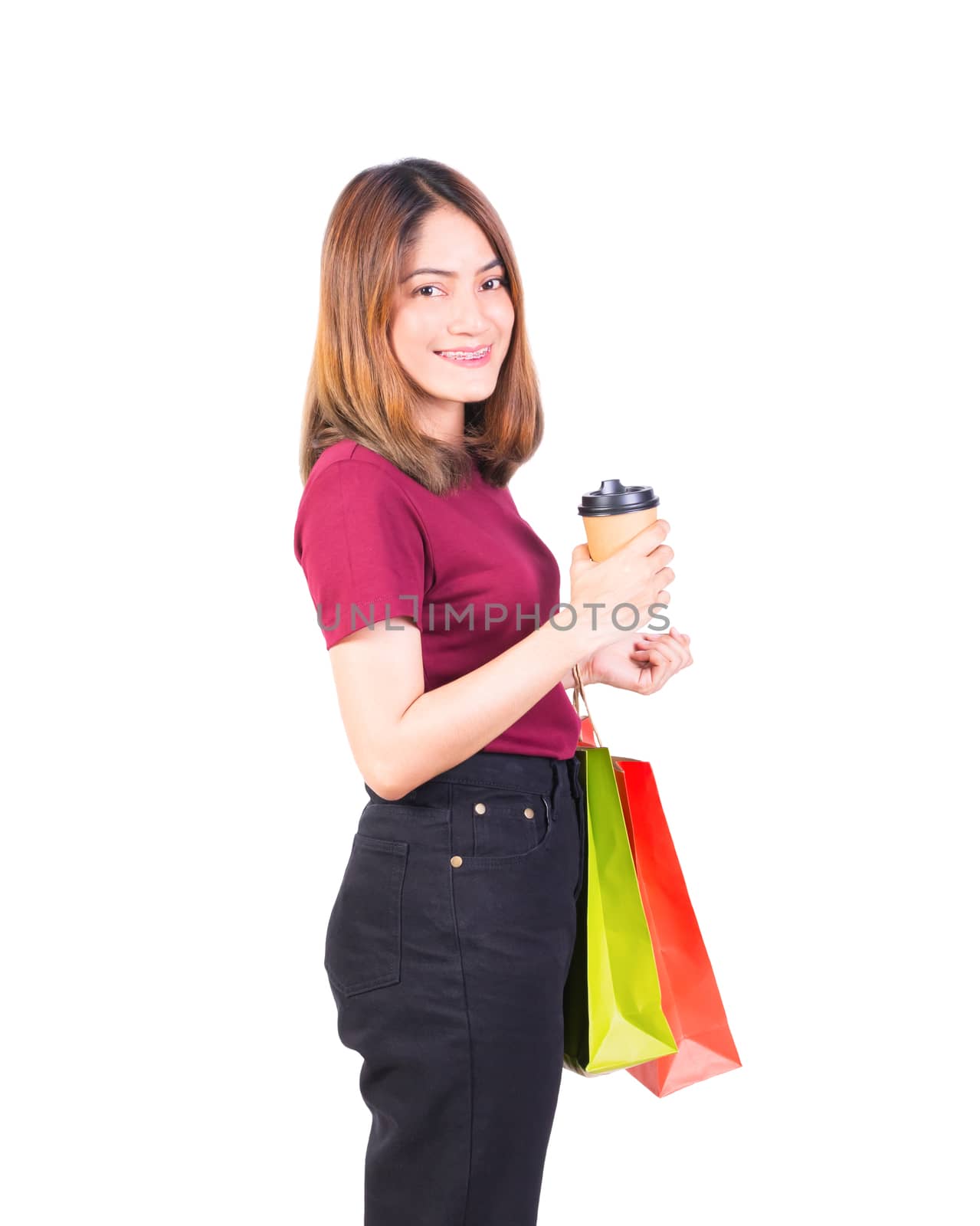 woman pretty smiling holding paper bags and Coffee carton cup by pramot