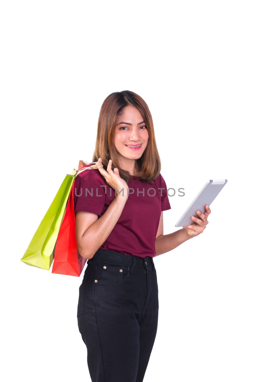 woman holding paper bags green and orange shopping And mobile phone. on white background
