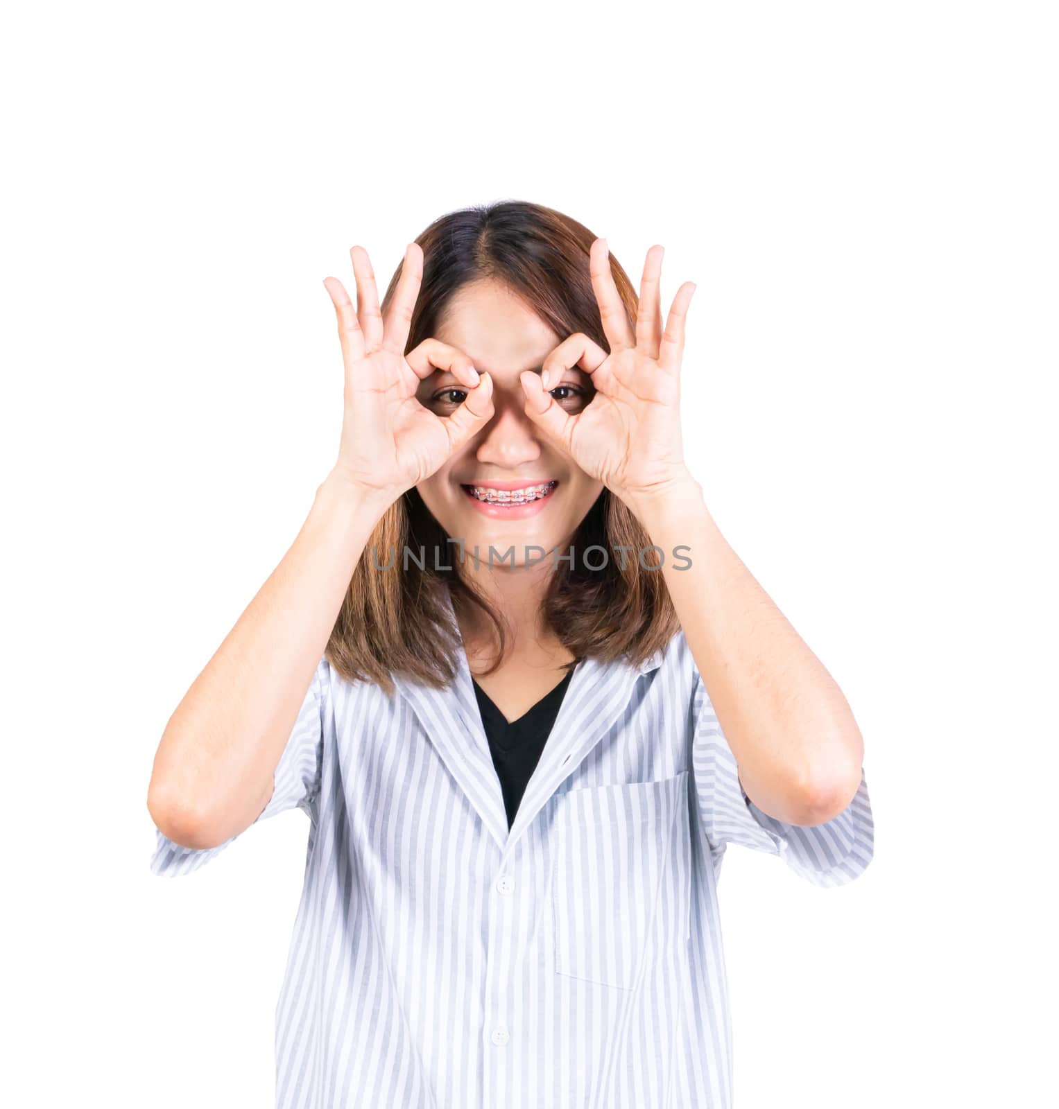 woman showing OK hand sign over eye on white background by pramot