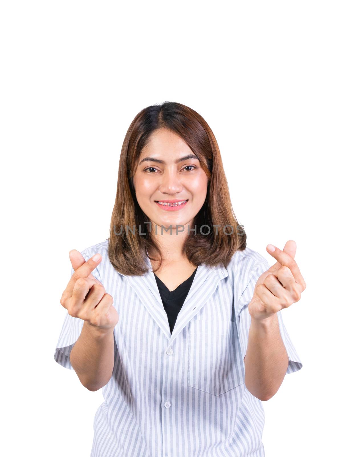 woman dental braces smile showing mini heart sign on white background