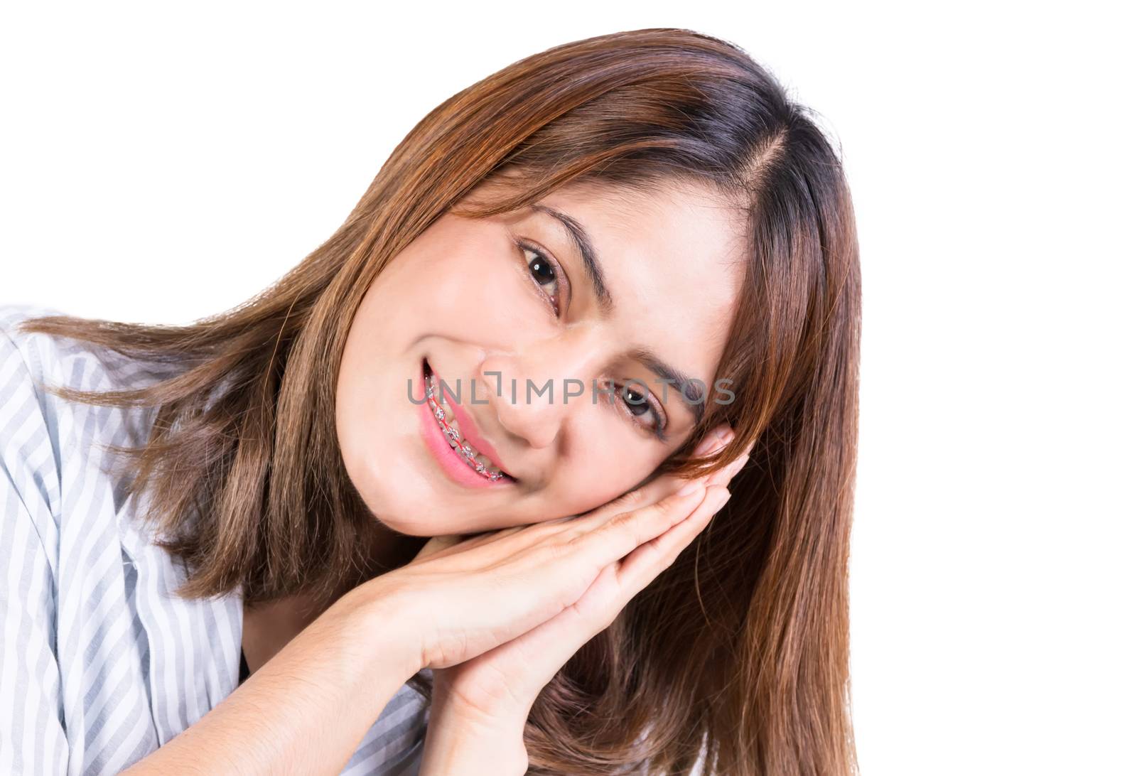 woman show sleeping on her hand with white background. close up portrait