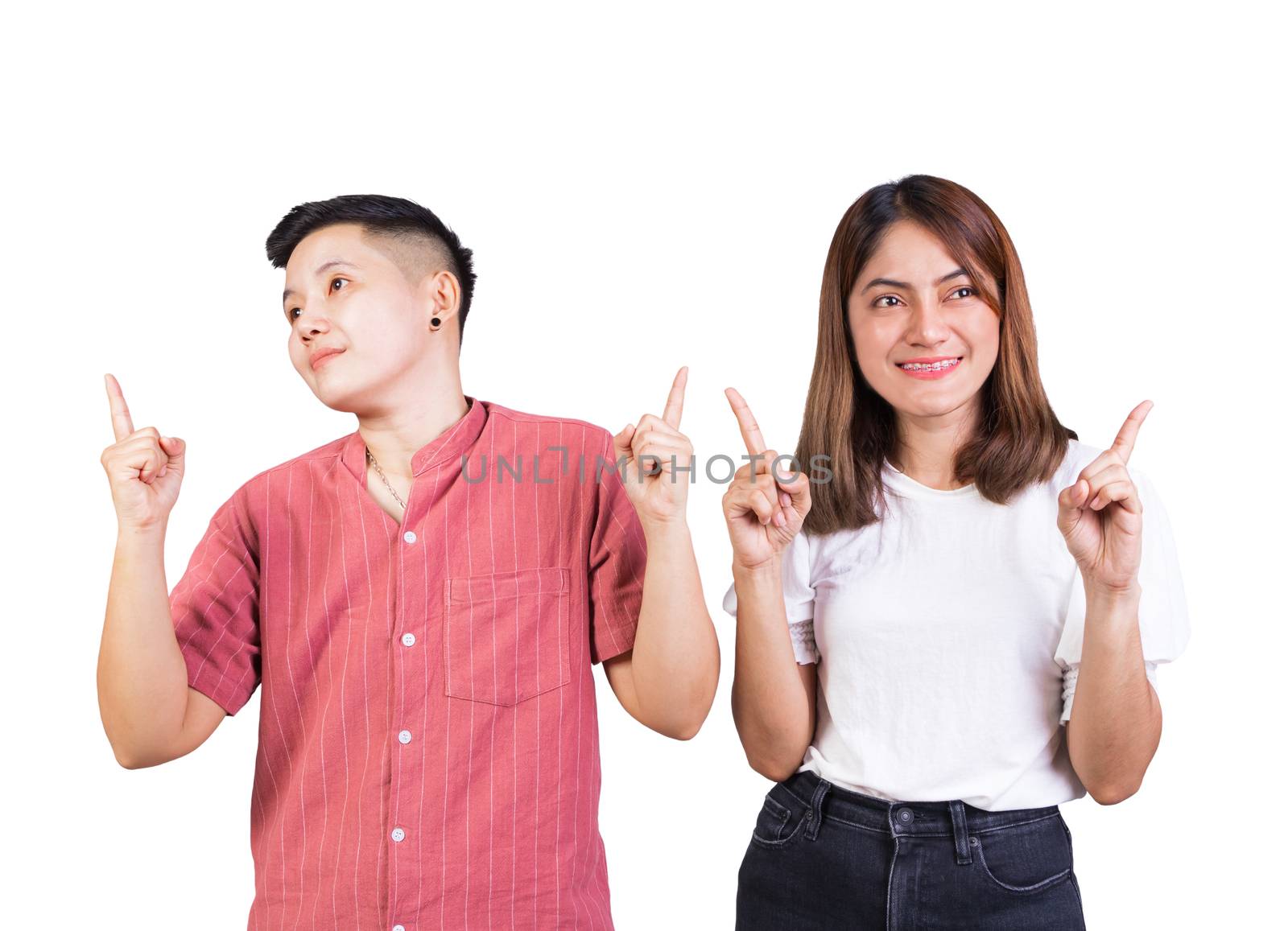 woman and tomboy pointing finger up happy couple on white background