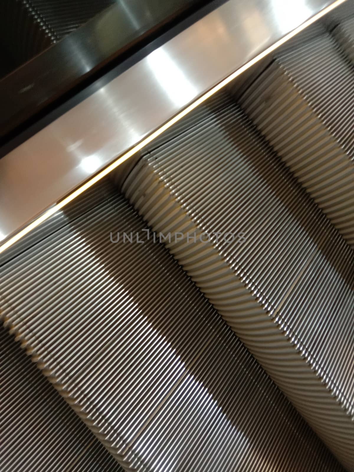 Escalator closeup in shopping mall for up down