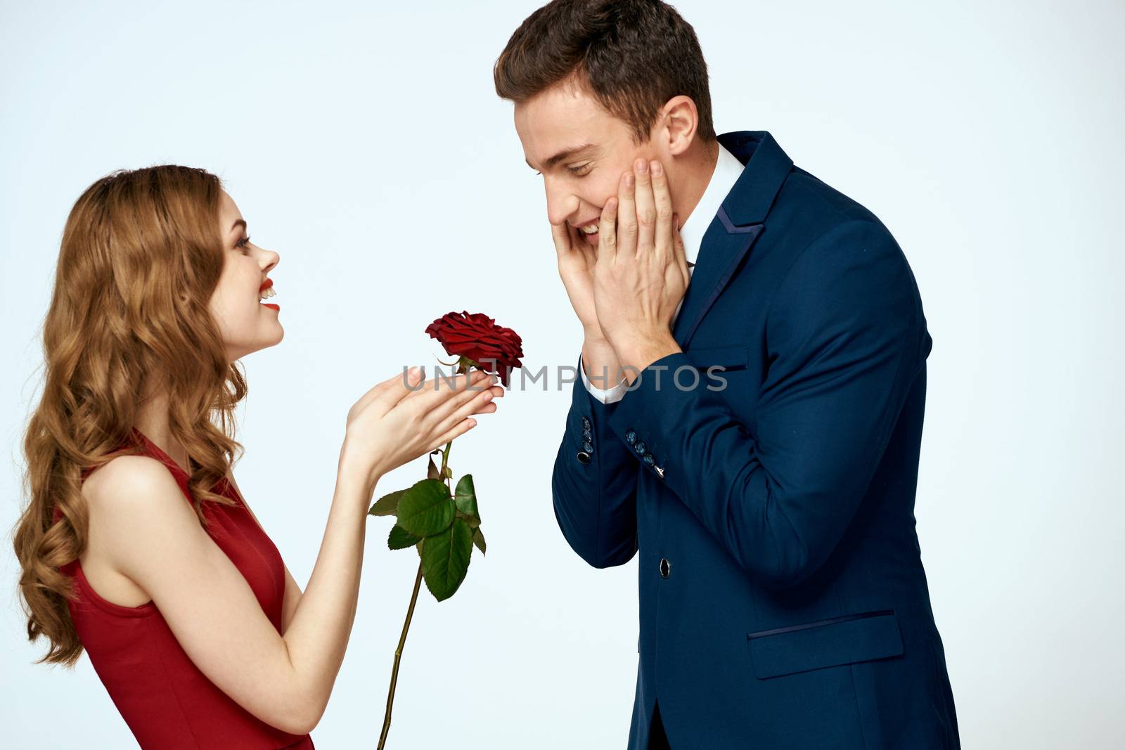 young couple gift rose holiday relationship romance. High quality photo